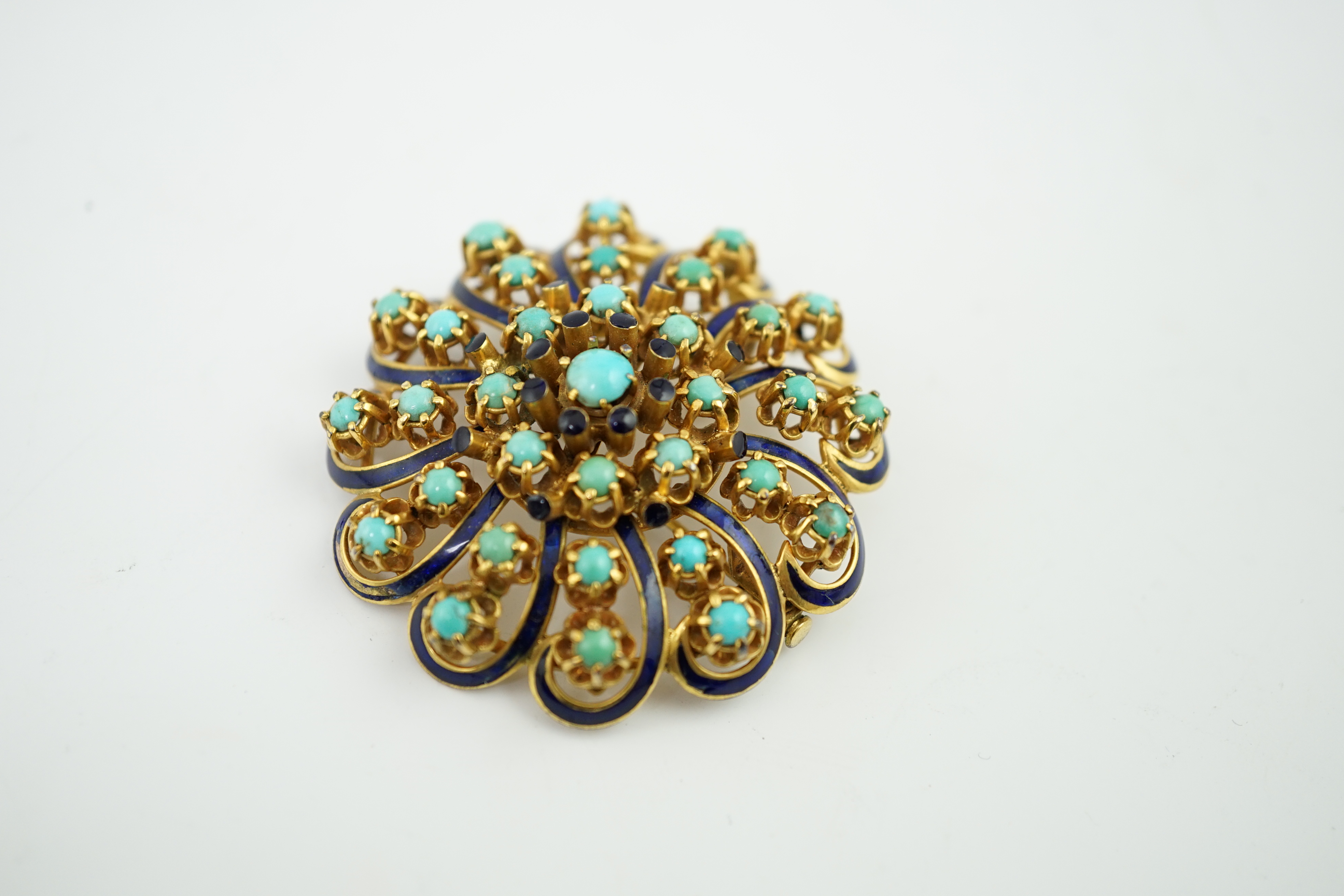 An early to mid 20th century gold, turquoise and blue enamel set whorl pendant brooch